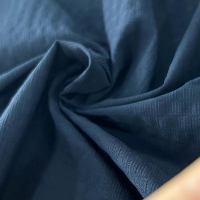 40D+20D*70D+40D+70D 100GSM Tejido reciclado de nylon espandéx 70D Repelente de agua con rejilla espumosa