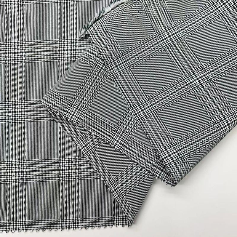 Tejido de estiramiento de 4 vías de poliéster catiónico de rejilla blanca y negra 200D+200D+40D*2 172GSM