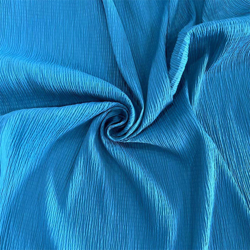 Tejido crepe de punto de burbuja 96GSM 97% Nylon 3% Spandex para faldas camisas
