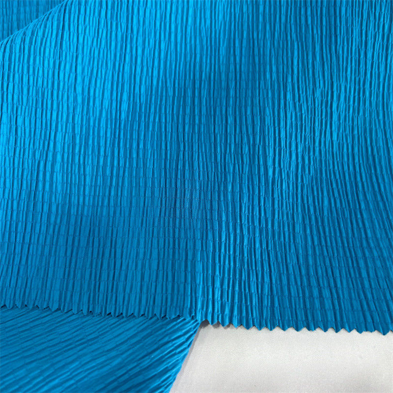 Tejido crepe de punto de burbuja 96GSM 97% Nylon 3% Spandex para faldas camisas