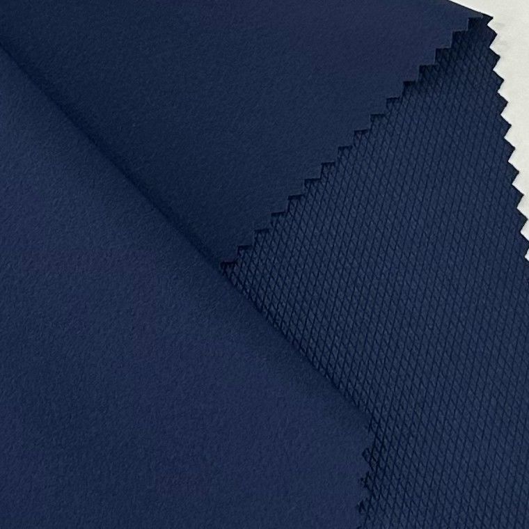 Tejido de estiramiento de cuatro vías con rejilla de diamantes 50D+20D*50D+20D/100D 140GSM 94% poliéster 6% spandex