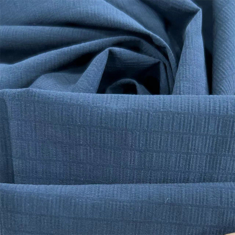 40D+20D*70D+40D+70D 100GSM Tejido reciclado de nylon espandéx 70D Repelente de agua con rejilla espumosa