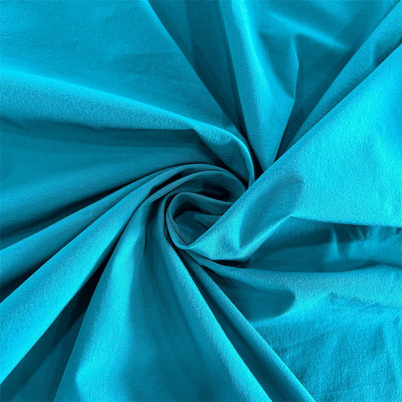 Tejido de spandex de nylon ligeramente arrugado reciclado de 4 vías de estiramiento 40D+20D*40D+20D 90GSM