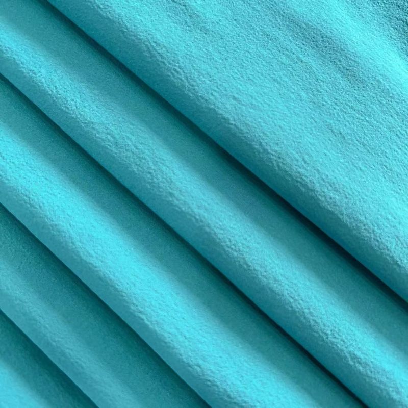 Tejido de spandex de nylon ligeramente arrugado reciclado de 4 vías de estiramiento 40D+20D*40D+20D 90GSM
