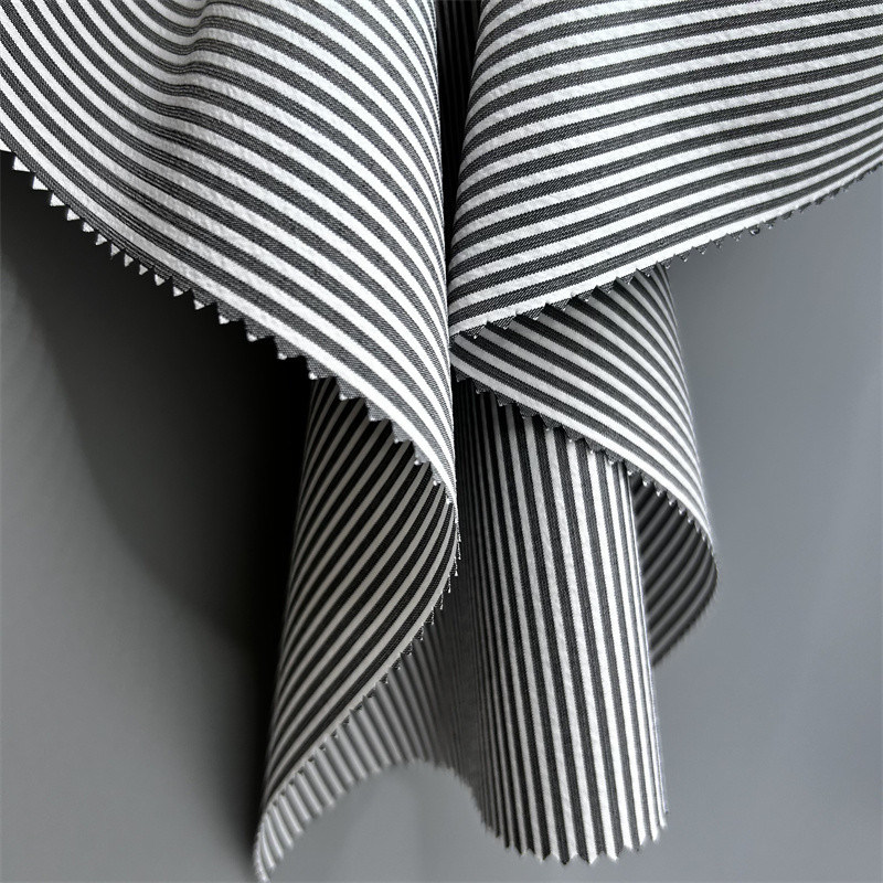Tejido de rayas verticales de poliéster reciclado catiónico 150D Efecto de doble tono en pantalones y fondos
